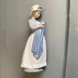 Lladro Nao #241 girl holding a puppy in a Blue and White Dress